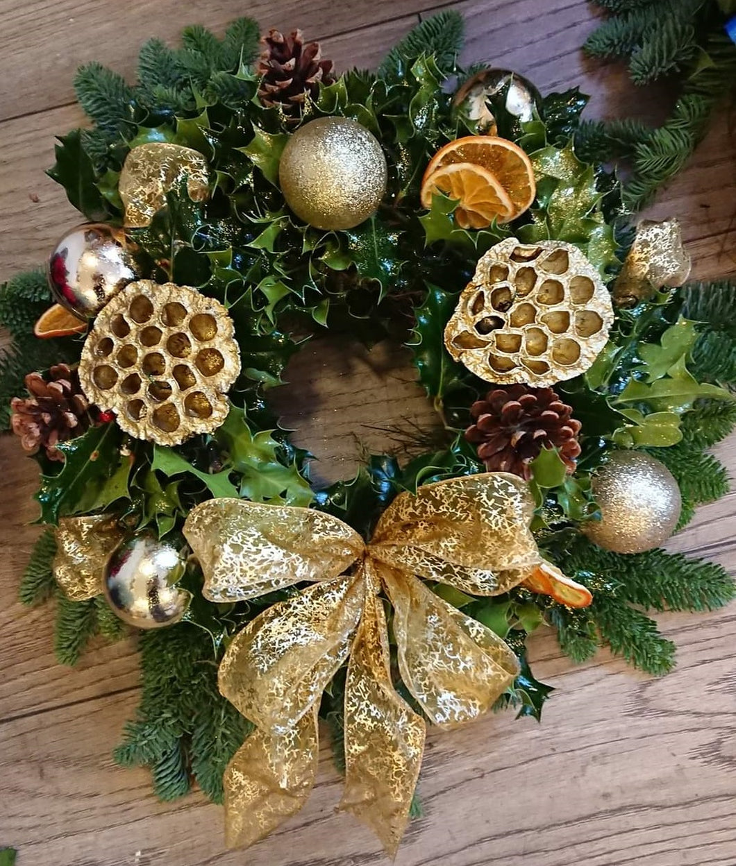 Gold holly wreath